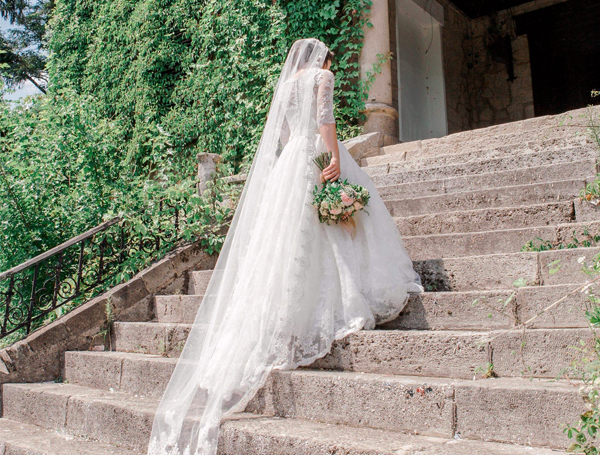 Wedding Dress Preservation - Bride Walking Up Stone Stairs