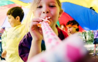 Party Photographer - Girl with Noisemaker